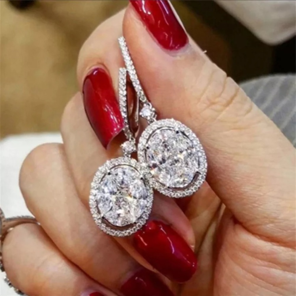 18kt White Gold Sapphire Oval Dangle Earrings